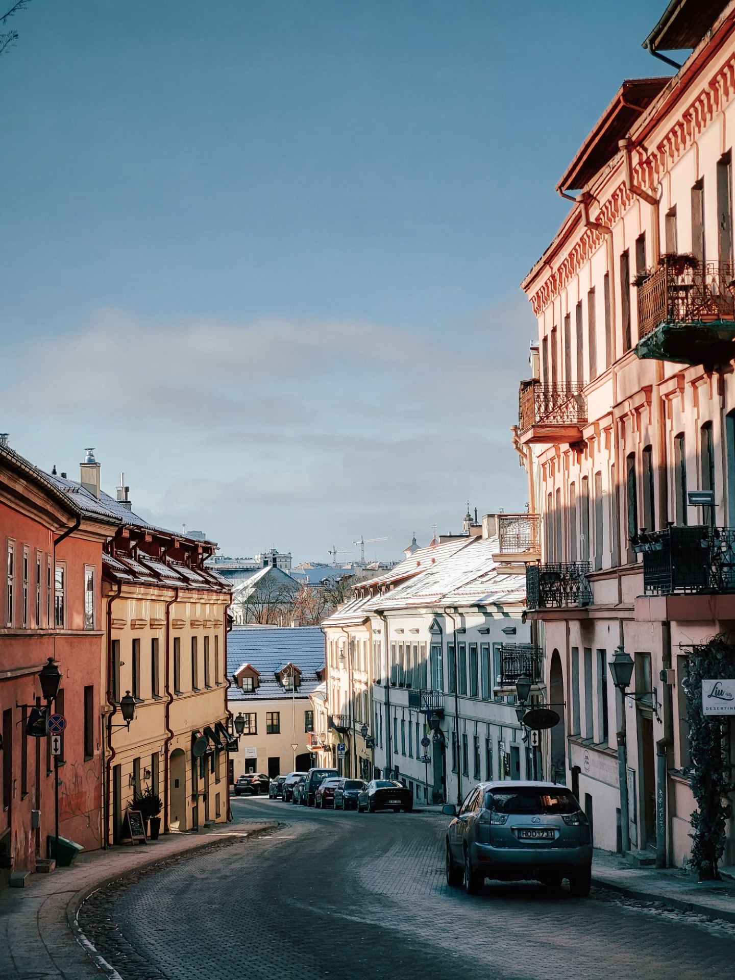 Historic street in Vilnius Old Town on a bright winter morning